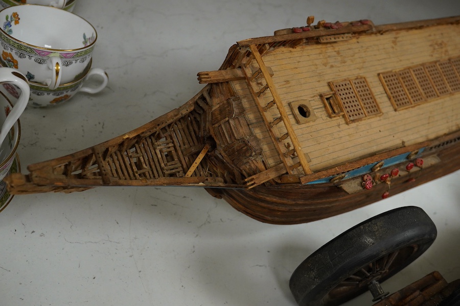 A scratch built model of a ship and a toy racing car and driver, ship 89cm wide. Condition - poor